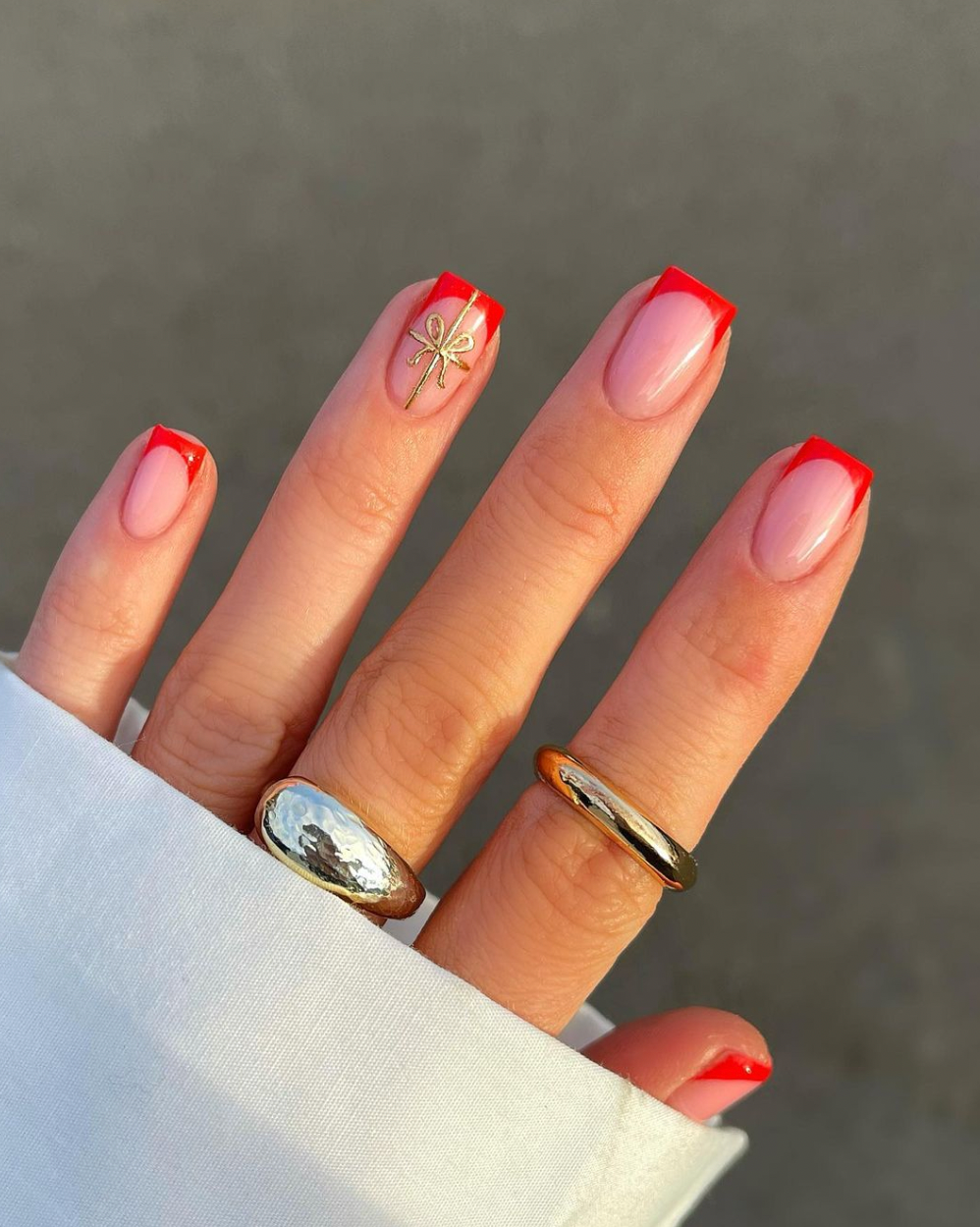 Festive Red French Tip Nails with Gold Bow — Winter Nail Colors for Women Over 40
