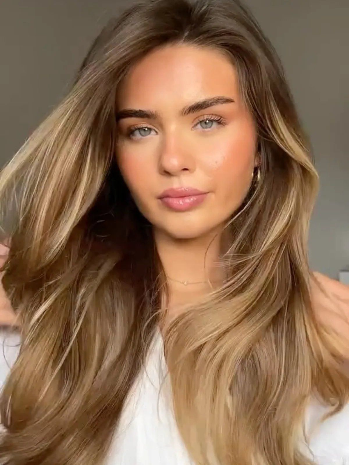 Collarbone Layers With Curtain Bangs and Blonde Highlights — Winter Haircuts for Girls