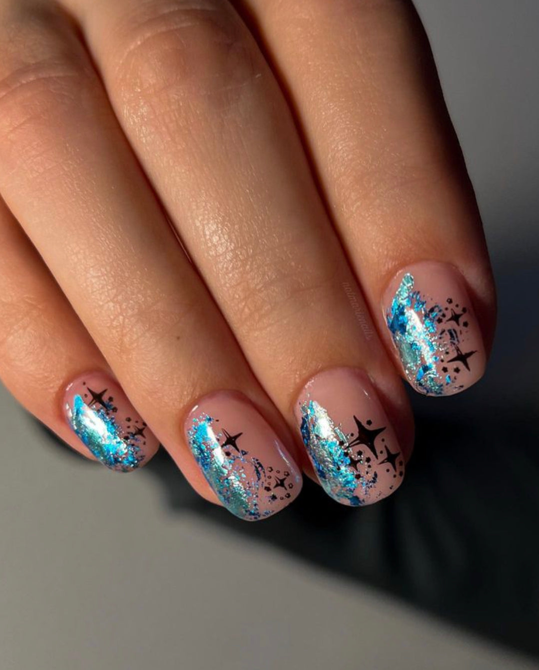 Short Oval with Blue Foil and Black Stars — Icy Blue Nails