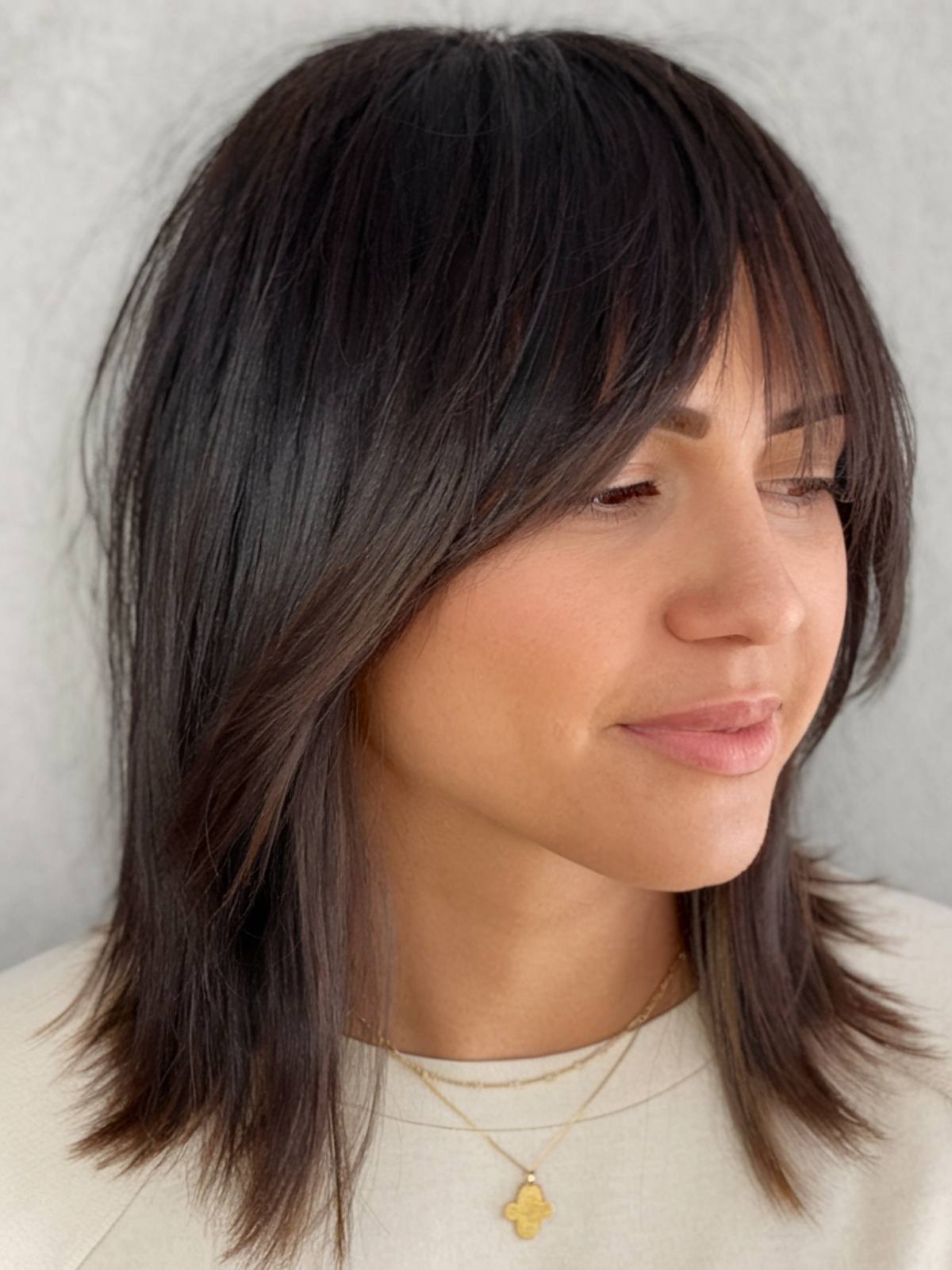 Textured Dark Brown Shag with Blunt Bangs — Winter Haircuts for Straight Hair