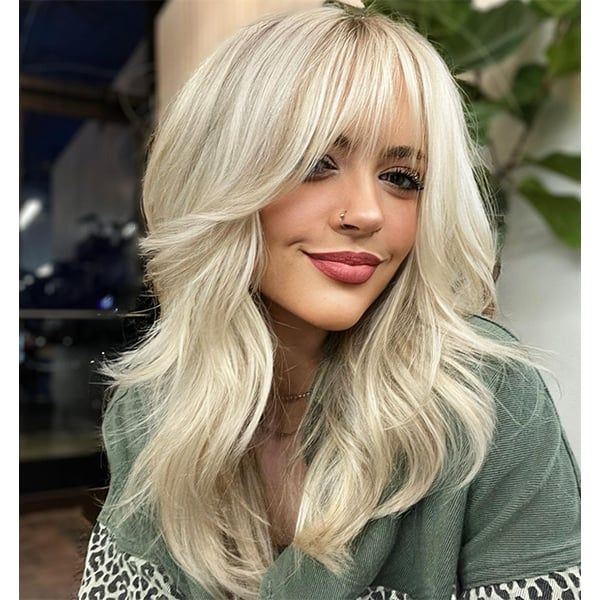 Ash Blonde Shag With Voluminous Layers and Bangs — Winter Haircuts with Bangs