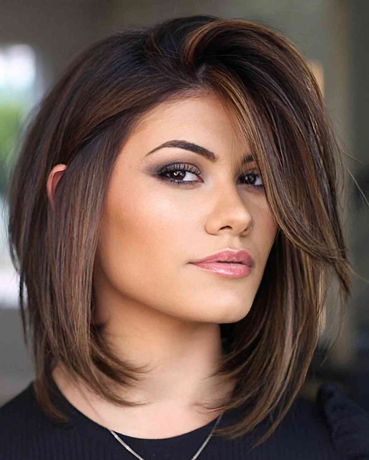 Angled Bob with Side-Swept Bangs — Winter Haircuts for Straight Hair