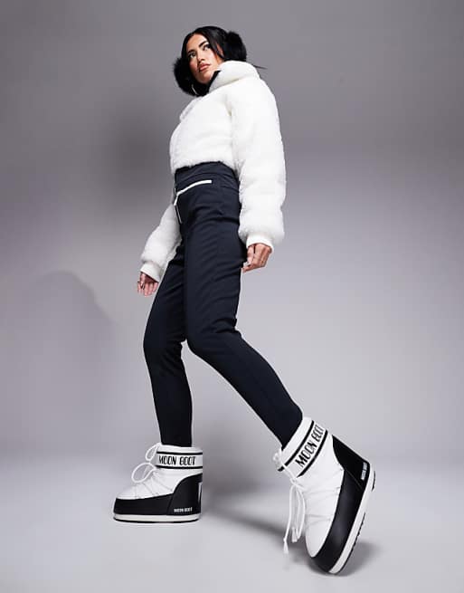 Chic Winter Fashion with White Fluffy Jacket and Black Pants — Moon Boots Outfits
