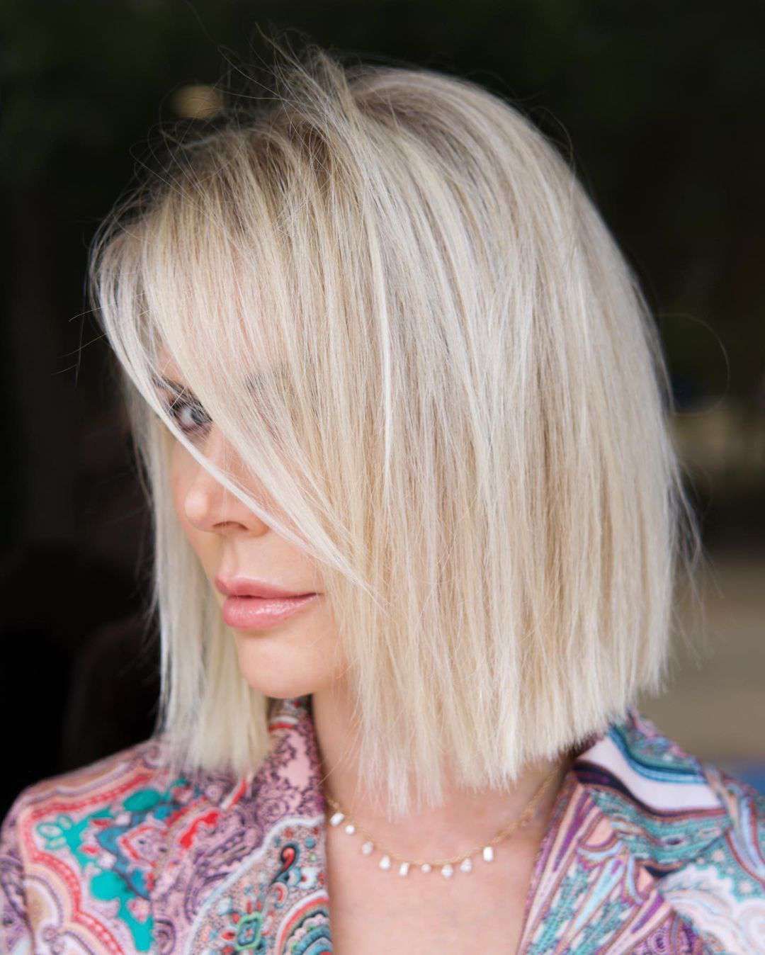 Platinum Blonde Bob with Blunt Bangs — Winter Haircuts for Women Over 50