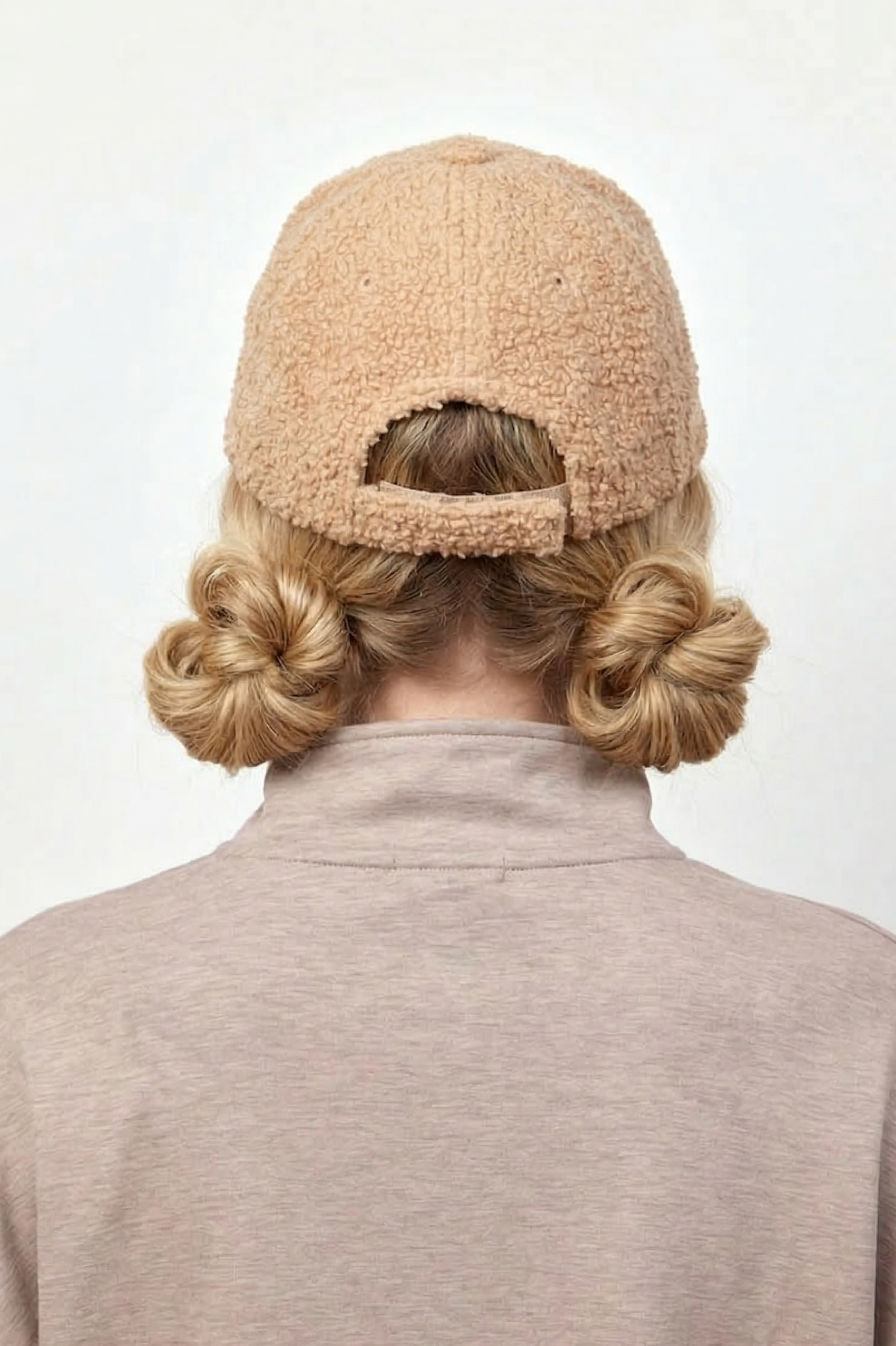Shoulder Length Blonde Two Low Buns With Baseball Cap Shoulder Length Blonde Two Low Buns With Baseball Cap — Winter Hat Hairstyles