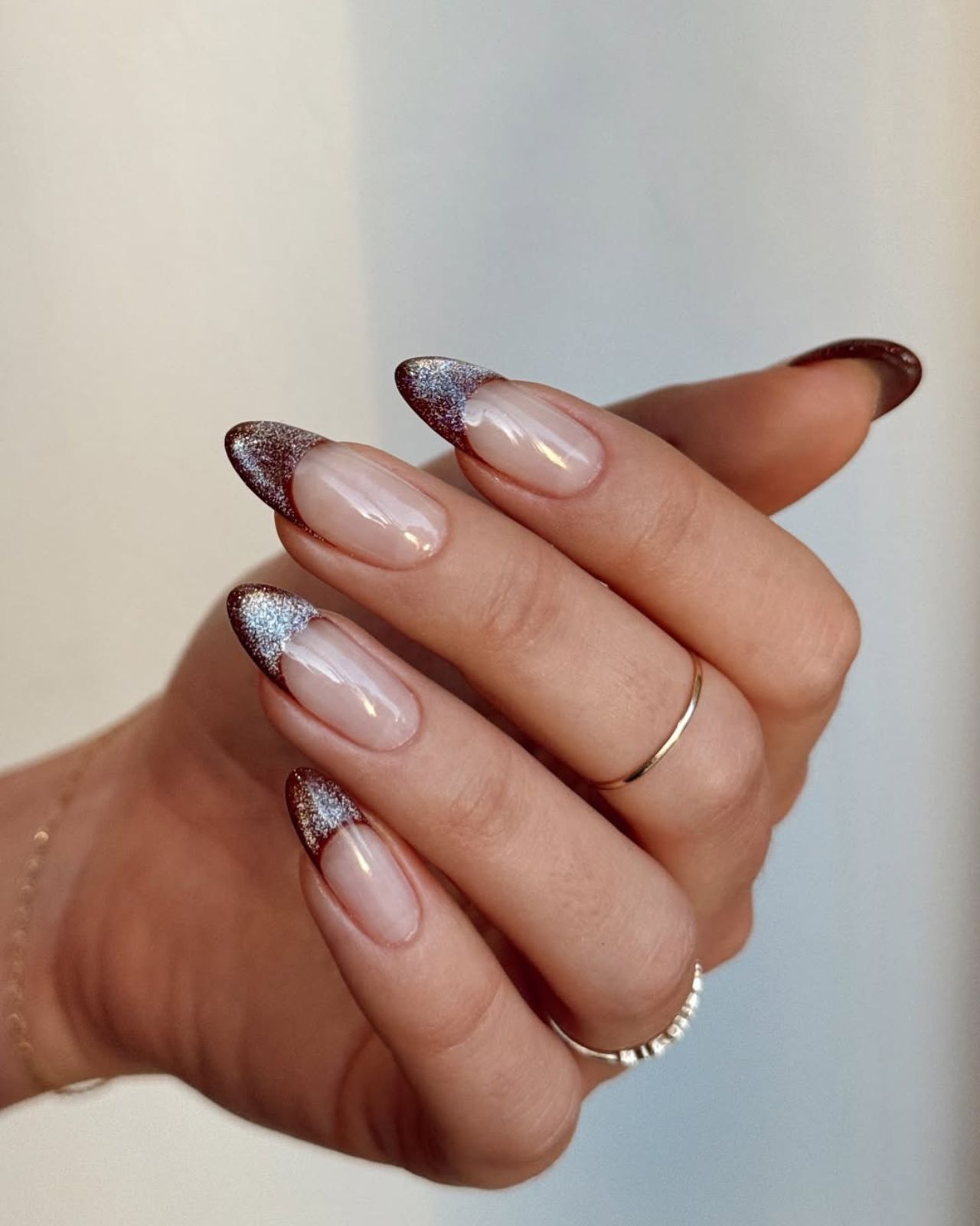 Sparkling Glitter French Tips on Nude Almonds Sparkling Glitter French Tips on Nude Almonds — Winter Nail Designs