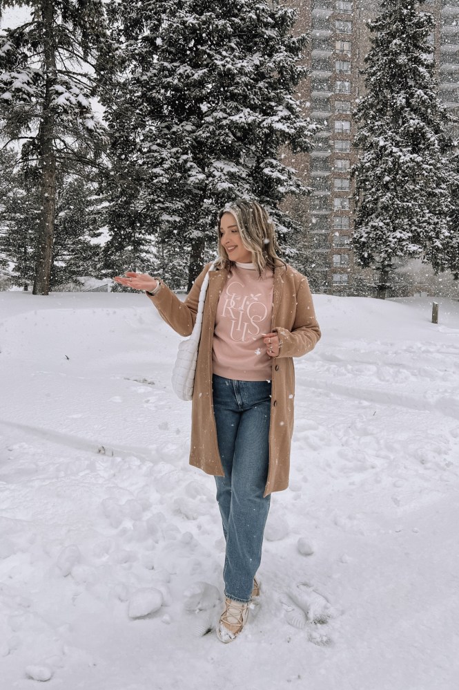 Camel Coat Over Graphic Sweatshirt with Tan Lace-Up Boots Camel Coat Over Graphic Sweatshirt with Tan Lace-Up Boots — Snow Day Outfits