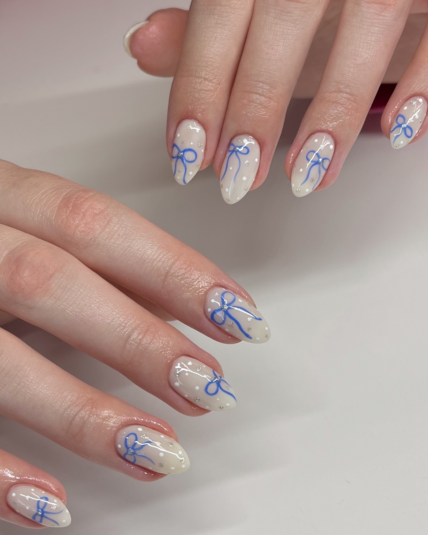 Off-White Almond Nails with Bows and Dots Off-White Almond Nails with Bows and Dots — Winter Gel Nails