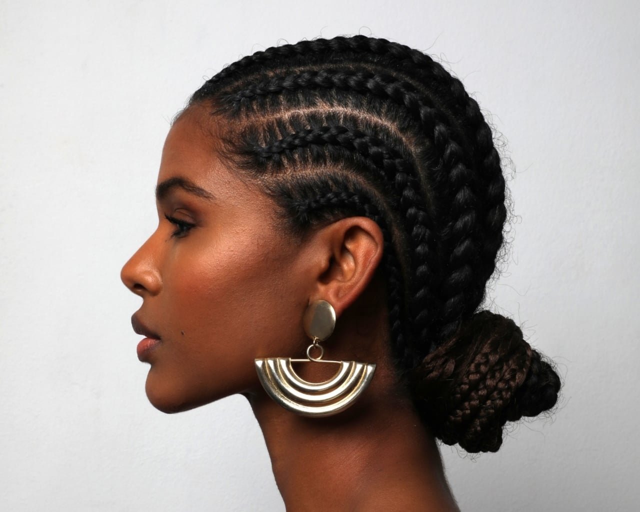Side Part Cornrows into Bun — Winter Protective Hairstyles