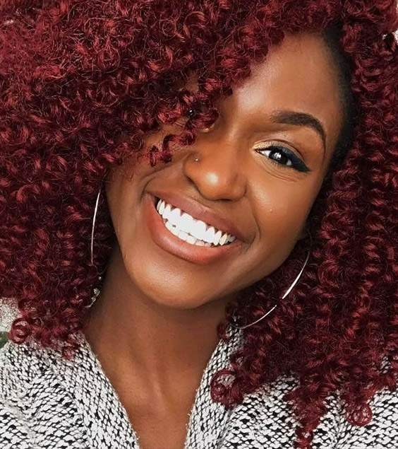 Vibrant Burgundy Shoulder-Length Curls Vibrant Burgundy Shoulder-Length Curls — Winter Hair Colors for Curly Hair