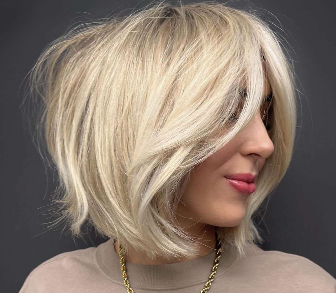 Ash Blonde Bob With Side Bangs — Winter Haircuts with Bangs