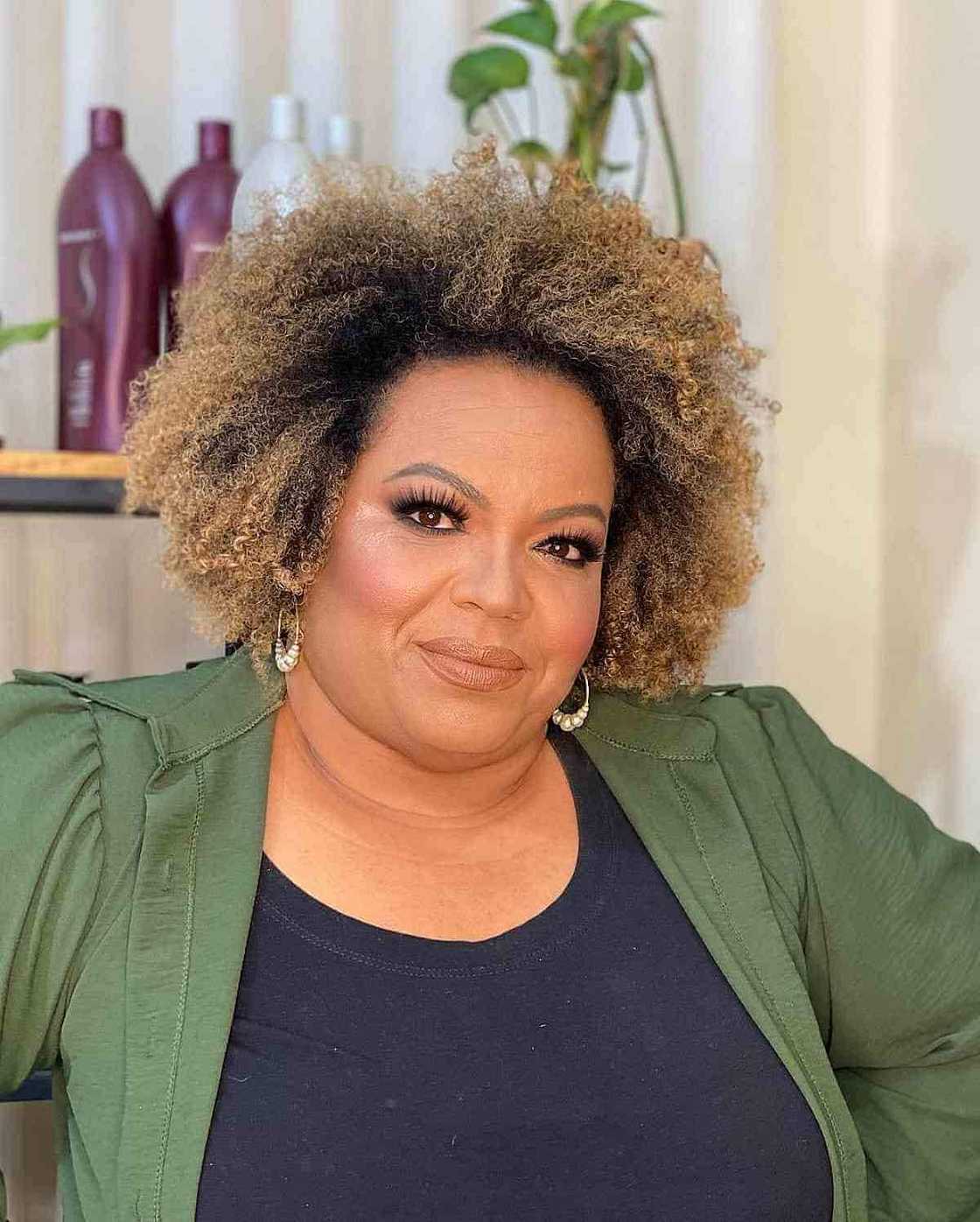 Voluminous Blonde Curls With Dark Roots Voluminous Blonde Curls With Dark Roots — Winter Hairstyles for Plus Size Women