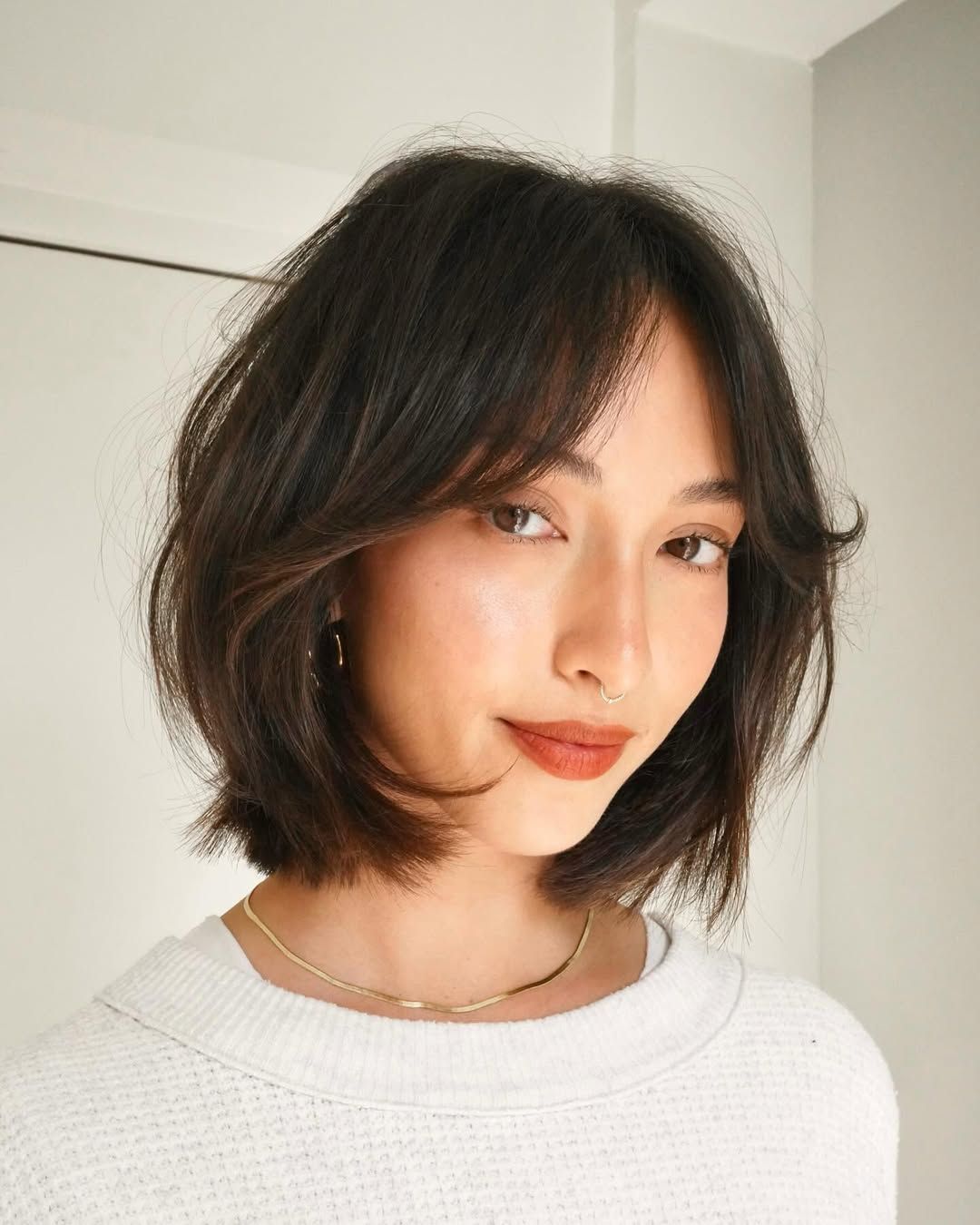 Textured Chin Bob With Wavy Curtain Bangs — Winter Haircuts with Curtain Bangs