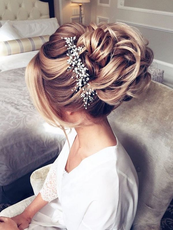 Voluminous Blonde Updo With Large Bun Voluminous Blonde Updo With Large Bun — Winter Wedding Hairstyles
