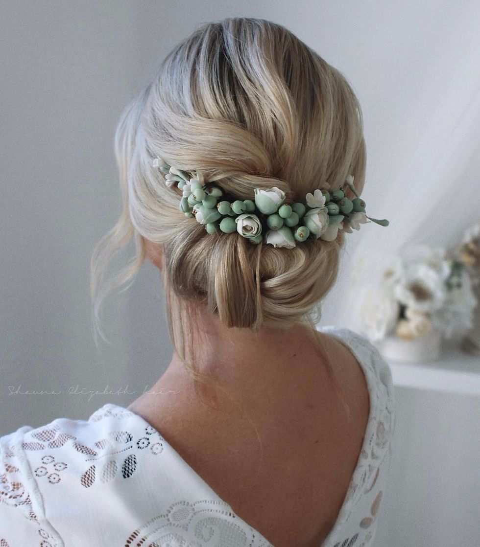 Blonde Twisted Updo With Floral Accent Blonde Twisted Updo With Floral Accent — Winter Wedding Hairstyles