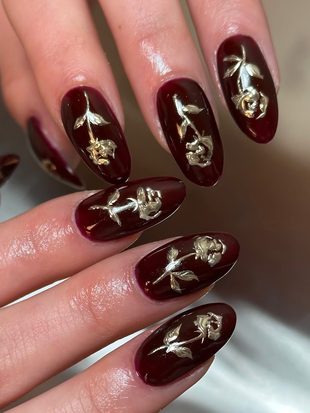 Elegant Deep Burgundy Oval Nails with Gold Rose Motif — Burgundy Nails