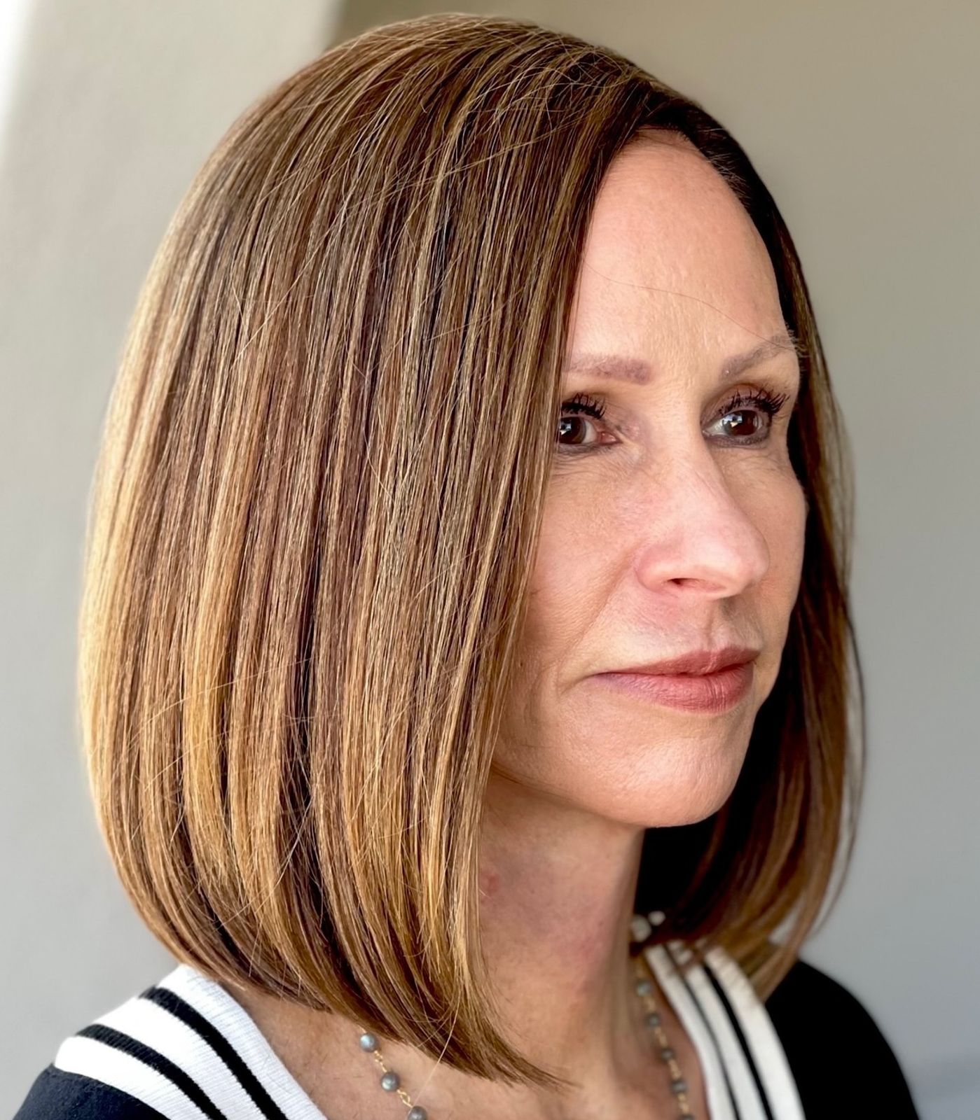 Brown With Blonde Highlights Visual Idea — Winter Haircuts for Women Over 40