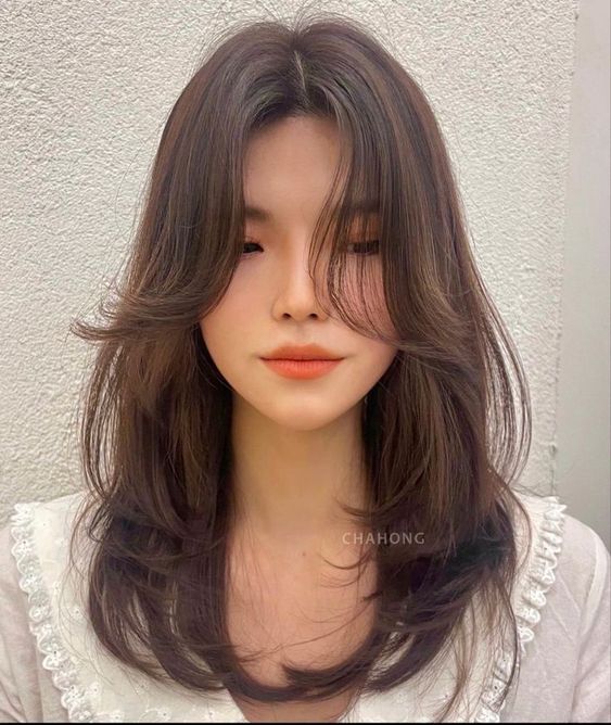 Layered Shag With Caramel Highlight Curtain Bangs — Winter Haircuts with Curtain Bangs