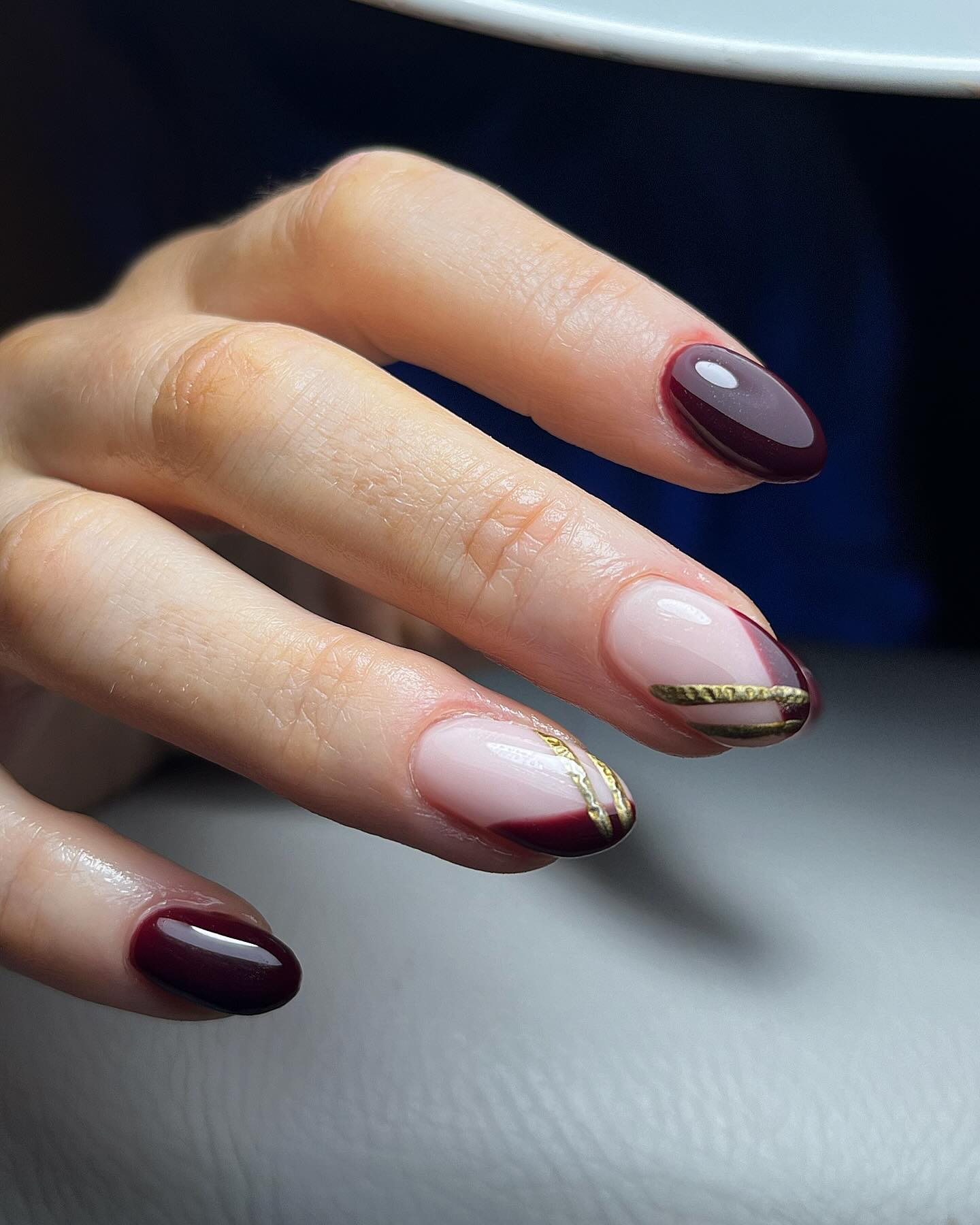 Chic Burgundy Tips with Gold Stripe Almond Nails — Burgundy Nails