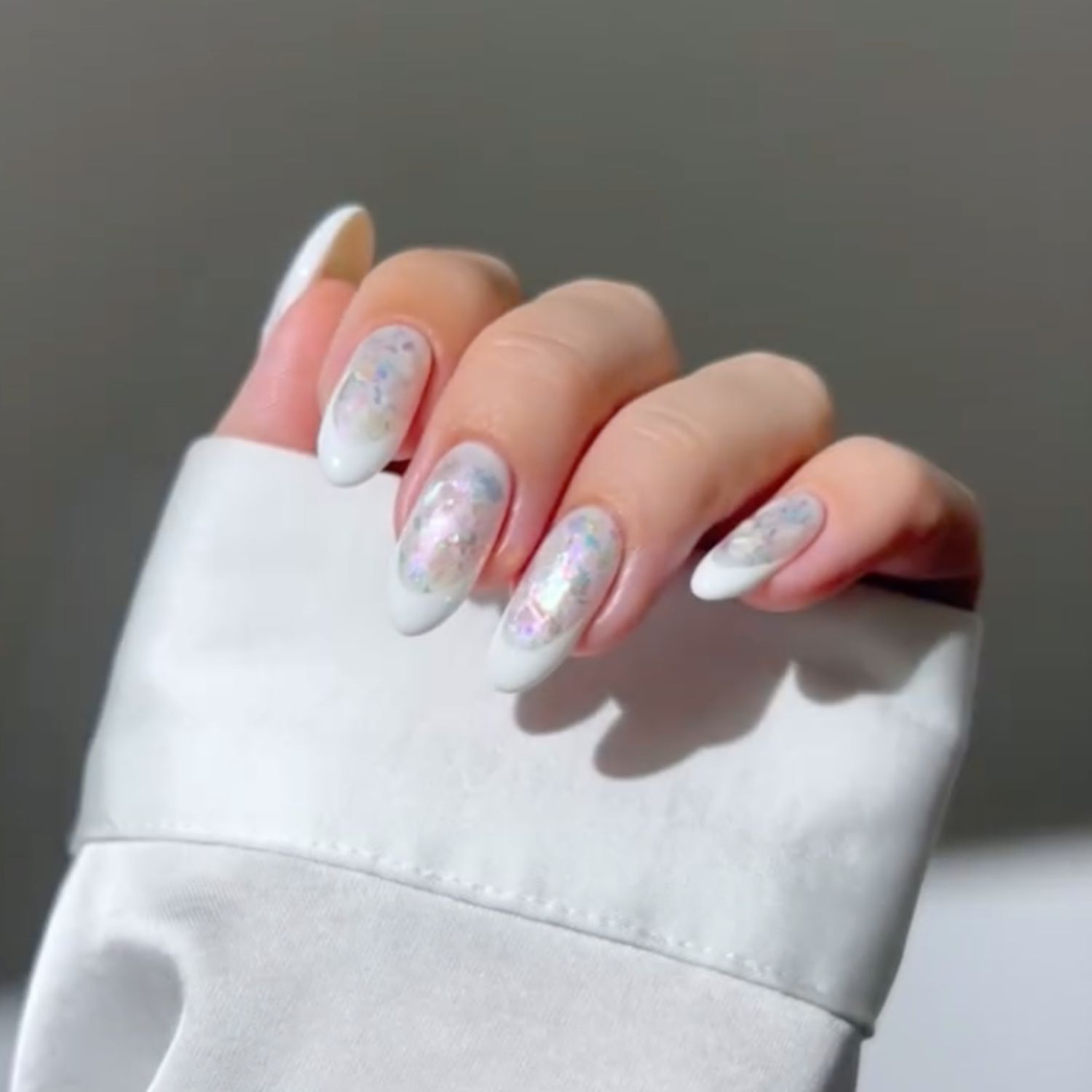 French Tips with Iridescent Glitter Accents — Winter White Nails