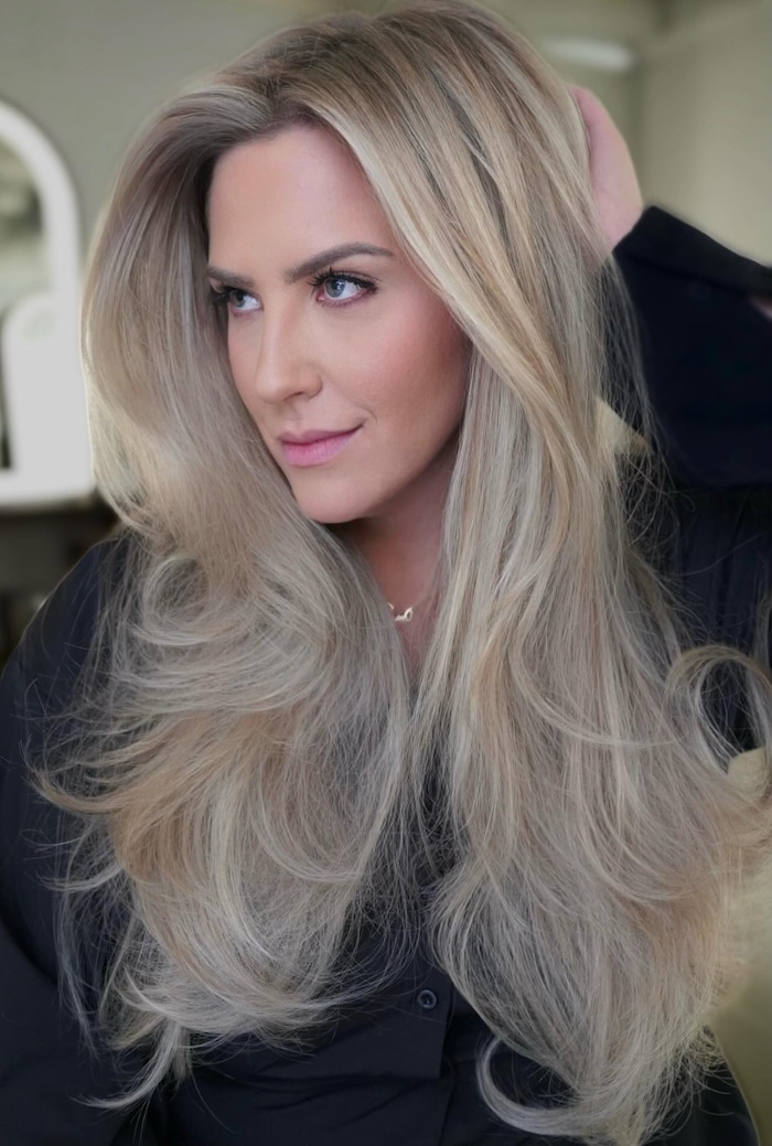 Voluminous Ash Blonde Curls Voluminous Ash Blonde Curls — Winter Haircuts for Oval Faces