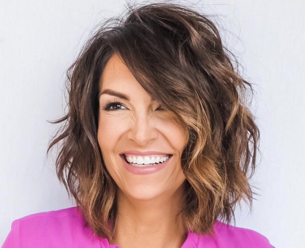Wavy Shag With Side-Swept Bangs — Winter Hairstyles for Women Over 60
