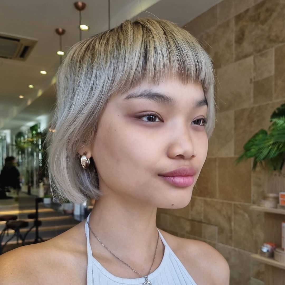 Ash Blonde Layered Bob with Micro Bangs — Winter Haircuts for Straight Hair