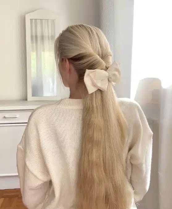 Sleek Ponytail With Twisted Detail — Cute Winter Hairstyles