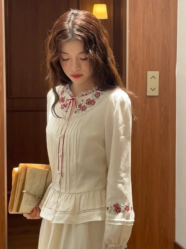 White Peplum Blouse With Floral Embroidery White Peplum Blouse With Floral Embroidery — Aesthetic White Blouse Outfit