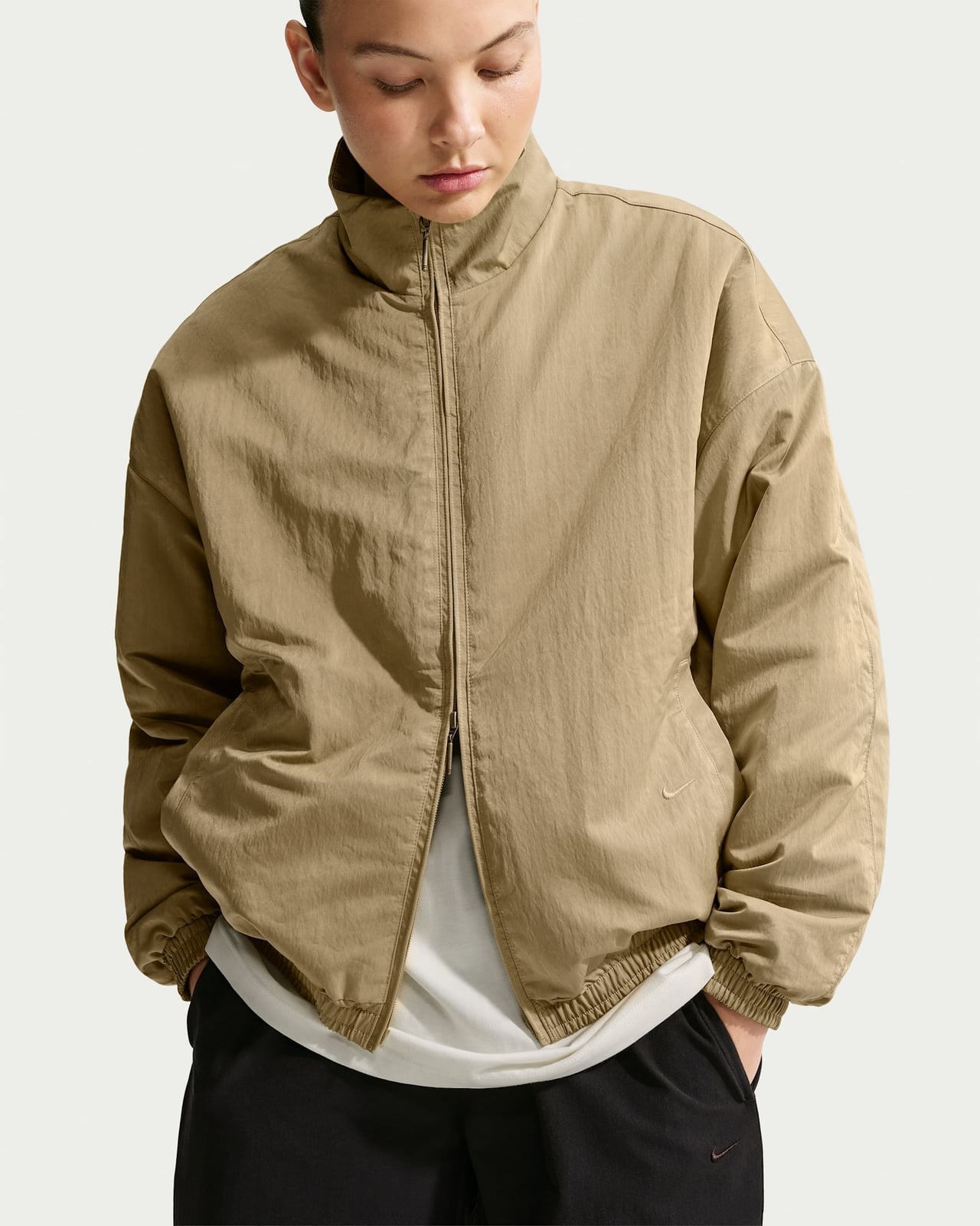 Beige Bomber Jacket Over White Tee and Black Pants Beige Bomber Jacket Over White Tee and Black Pants — Basketball Game Outfits