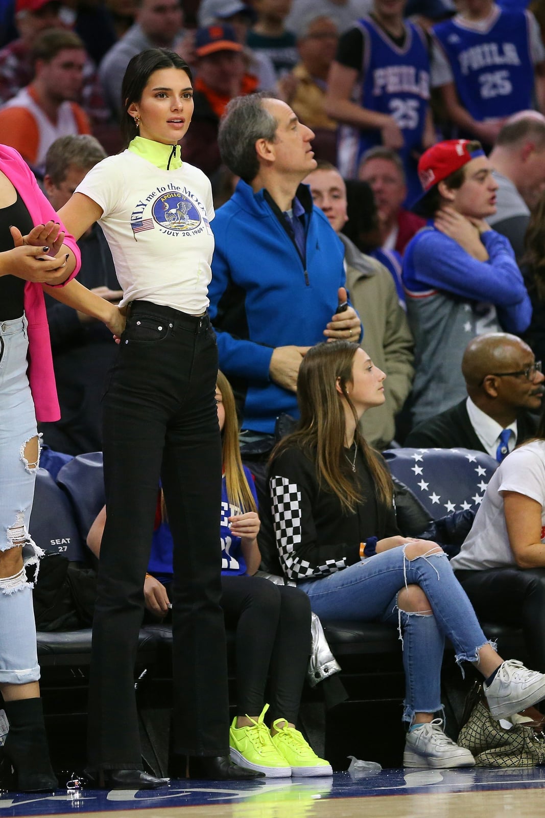 Graphic T-shirt With Black Jeans and Neon Sneakers Graphic T-shirt With Black Jeans and Neon Sneakers — Basketball Game Outfits