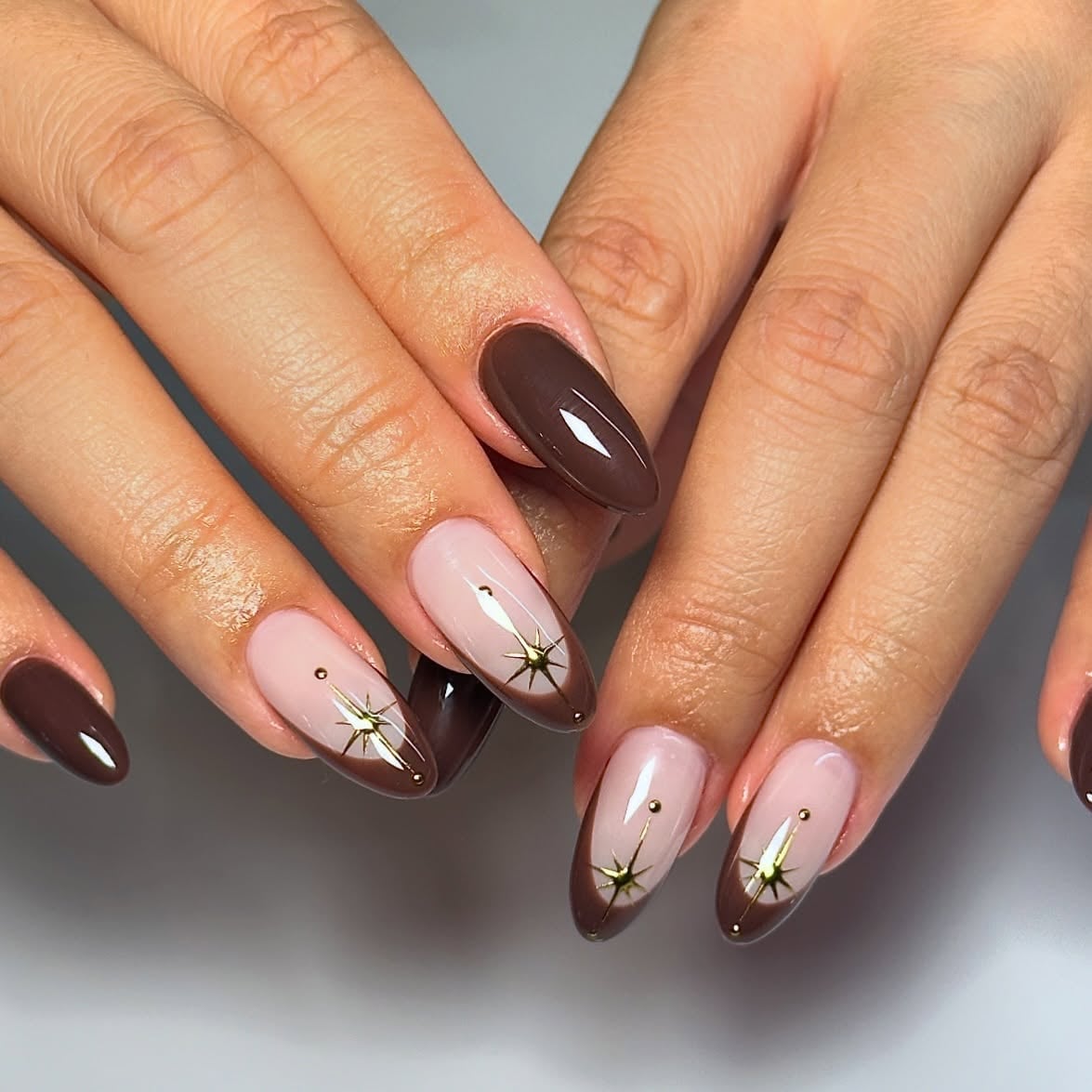Medium Almond Nails with Dark Brown and Gold Stars — Brown Almond Nails