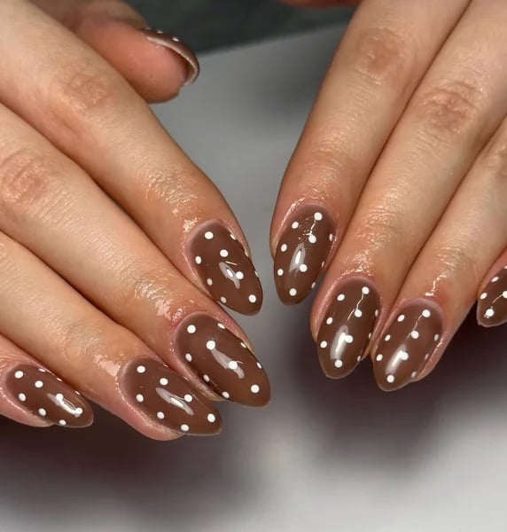 Glossy Brown Almond Nails with White Polka Dots