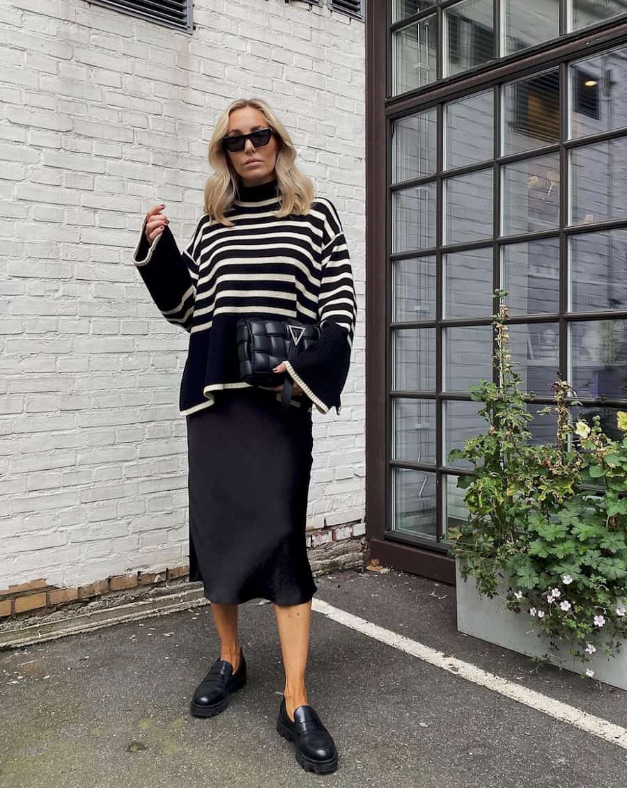 Chic Black Loafers With Satin Skirt And Striped Sweater — Classy Black Loafers Outfit