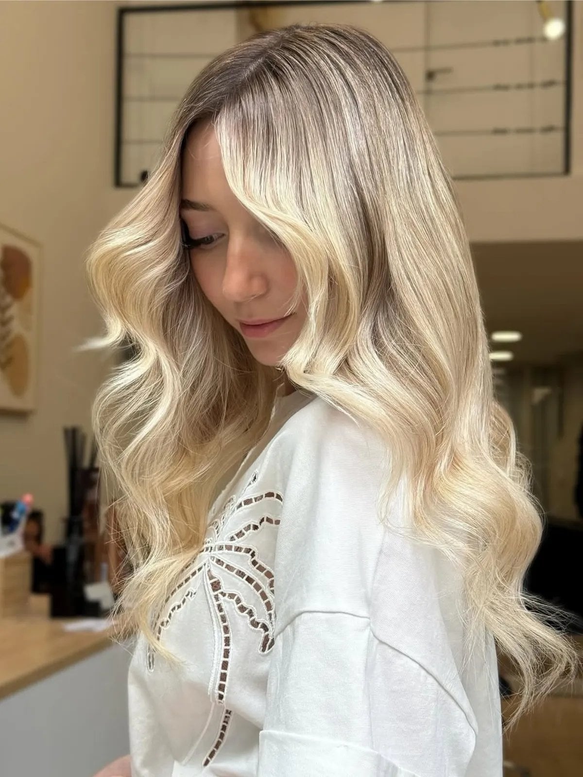 Platinum Blonde Mid-Back Waves with Wispy Bangs Platinum Blonde Mid-Back Waves with Wispy Bangs — Classy Blonde Wavy Hair