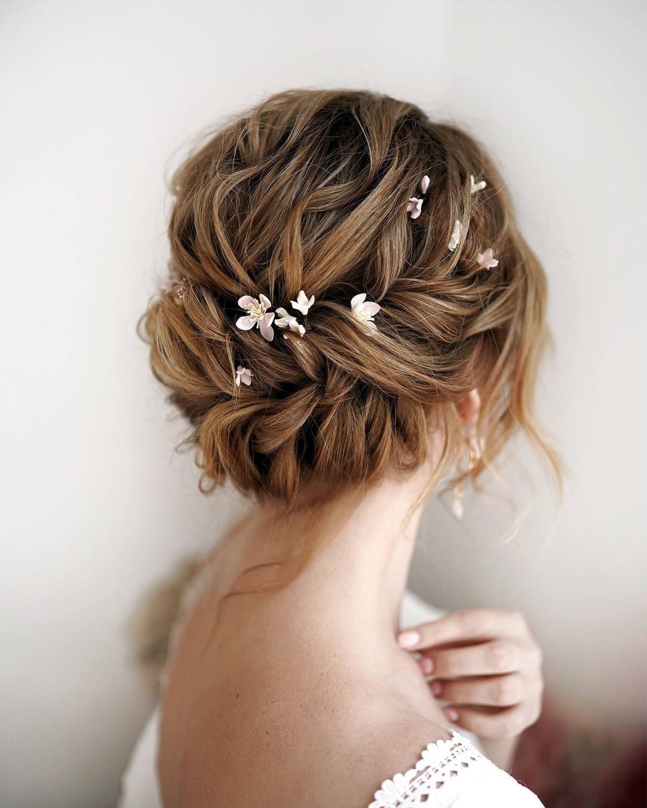 Reddish-Brown Textured Updo With Floral Pins Reddish-Brown Textured Updo With Floral Pins — Classy Bridesmaid Hair