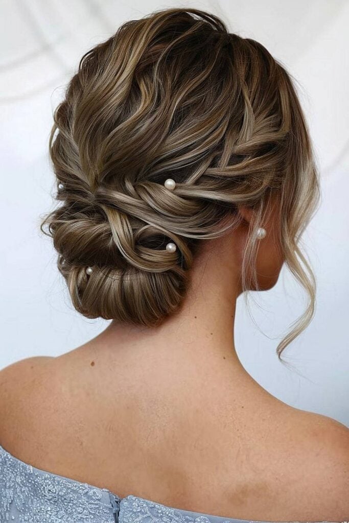 Brown Twisted Low Bun With Pearls Brown Twisted Low Bun With Pearls — Classy Bridesmaid Hair