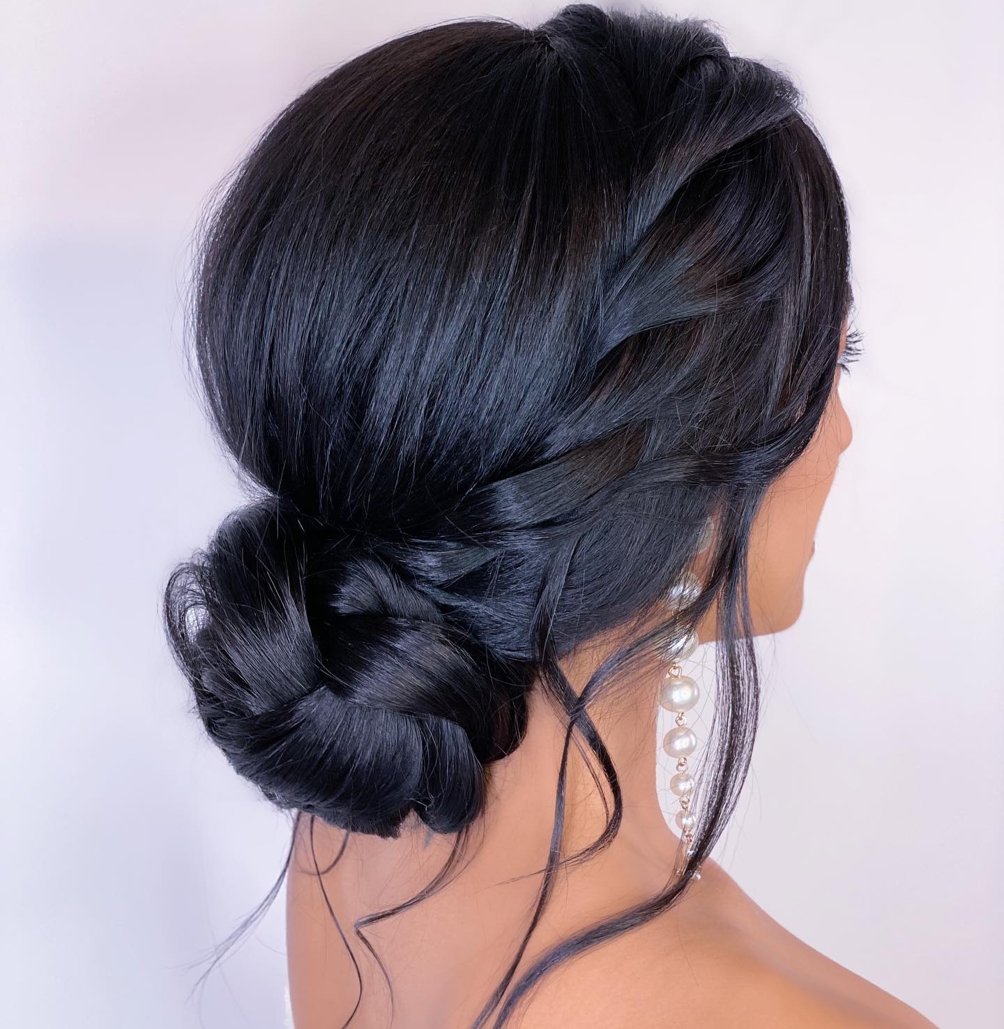 Low Braided Bun With Loose Tendrils Low Braided Bun With Loose Tendrils — Classy Bridesmaid Hair Updo