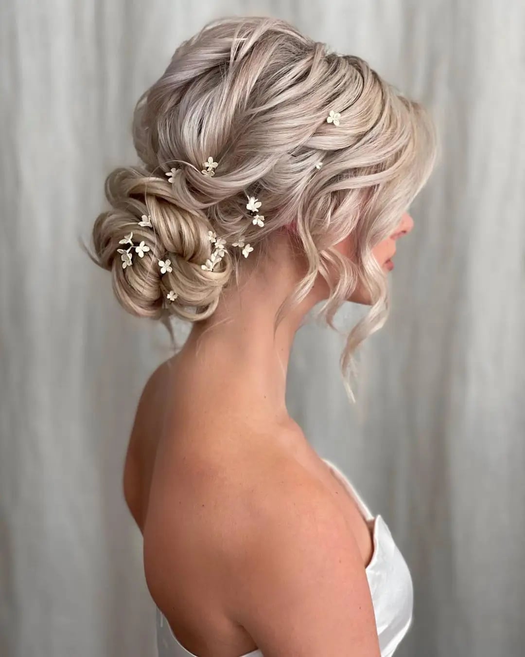 Platinum Blonde Updo With Floral Accents Platinum Blonde Updo With Floral Accents — Classy Bridesmaid Hairstyles Updo
