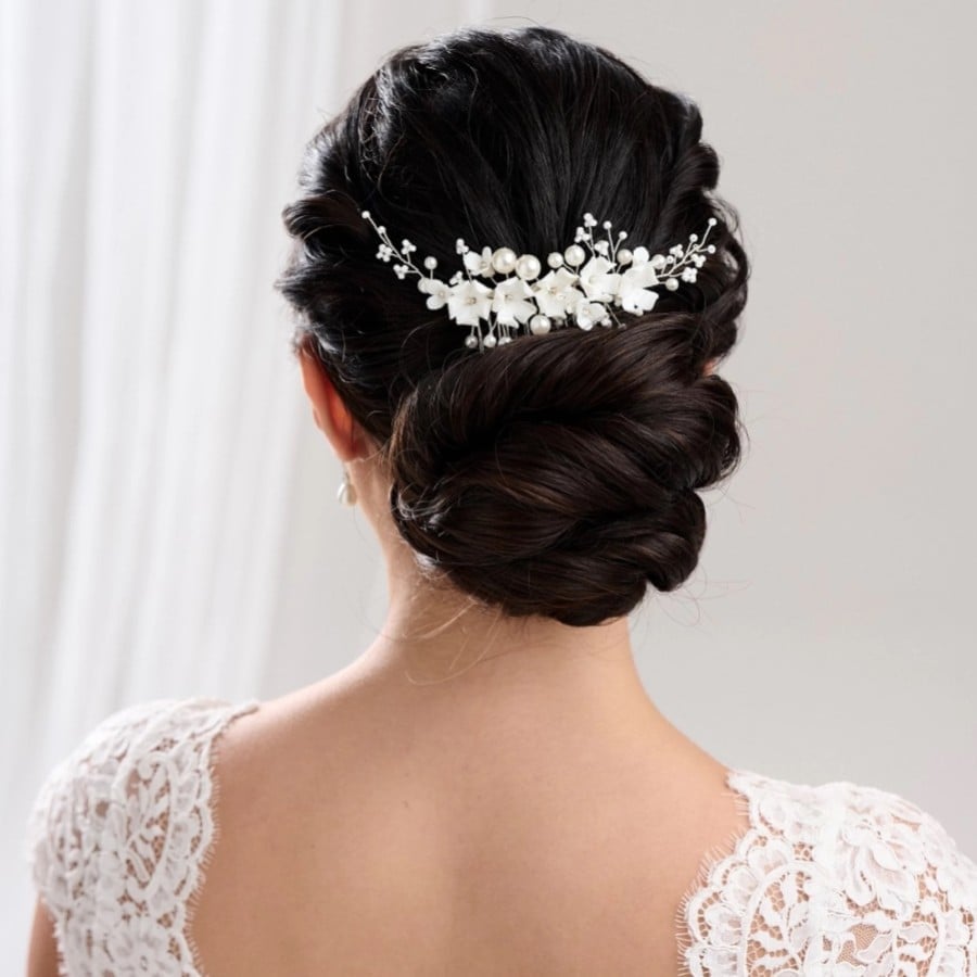 Classic Low Bun With Floral Accessory Classic Low Bun With Floral Accessory — Classy Bridesmaid Hairstyles Updo