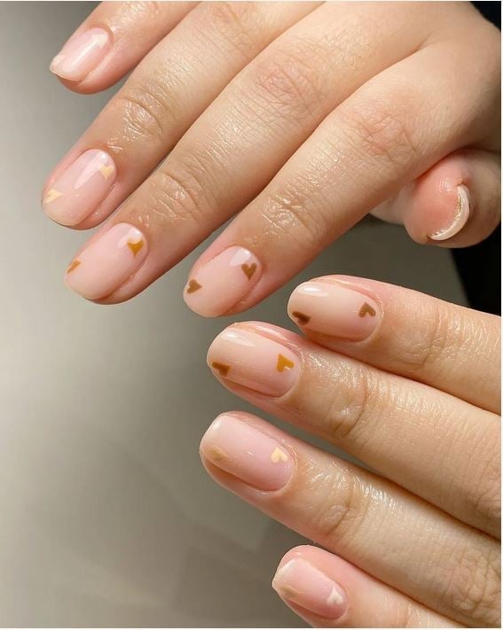 Short Oval Pale Pink With Gold Heart Decals — Classy Bridesmaid Nails