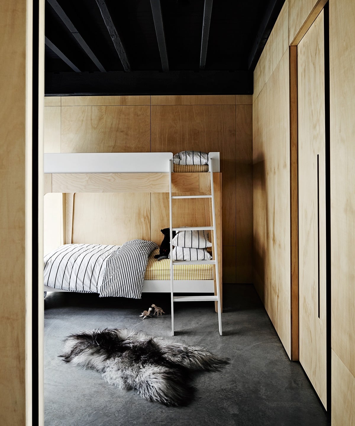 Minimalist White Bunk Bed with Sheepskin Rug — Classy Bunk Bed Ideas