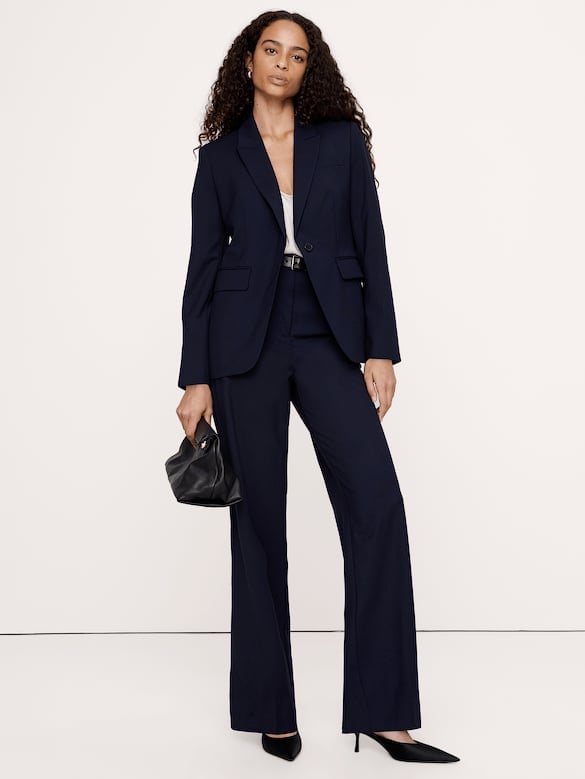 Navy blazer and wide-leg trousers create a polished look Navy blazer and wide-leg trousers create a polished look — Classy Business Casual Outfits