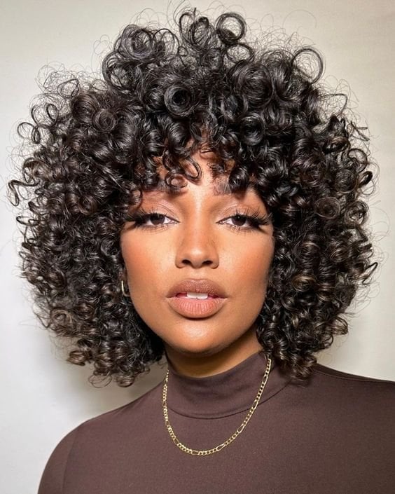 Chin-Length Bob With Layers and Straight Fringe — Classy Curly Hair Hairstyles