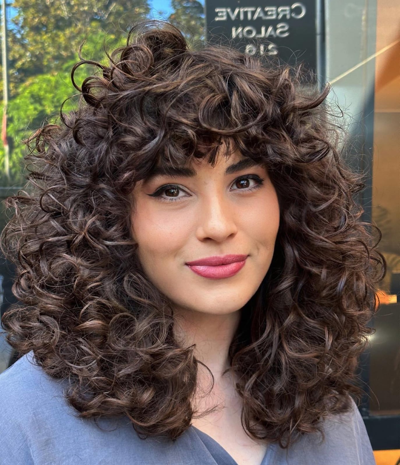 Collarbone Blowout With Bouncy Curls and Curtain Bangs — Classy Curly Hair Hairstyles