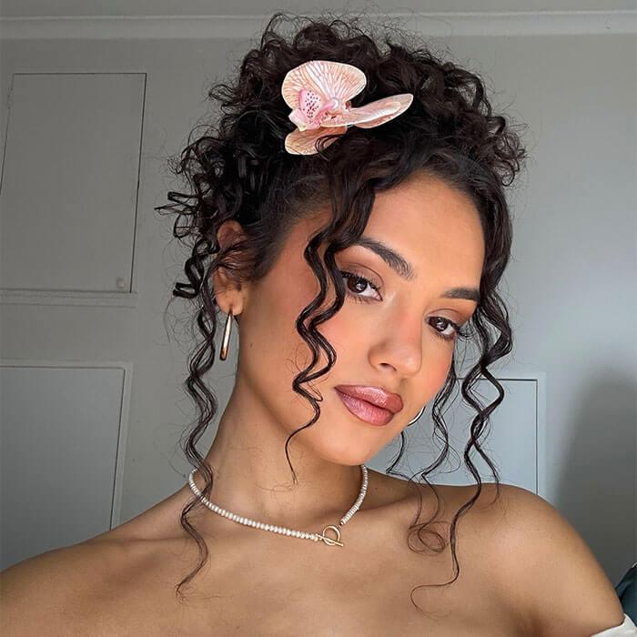 Mid-Back Updo With Loose Face-Framing Curls — Classy Curly Hair Hairstyles