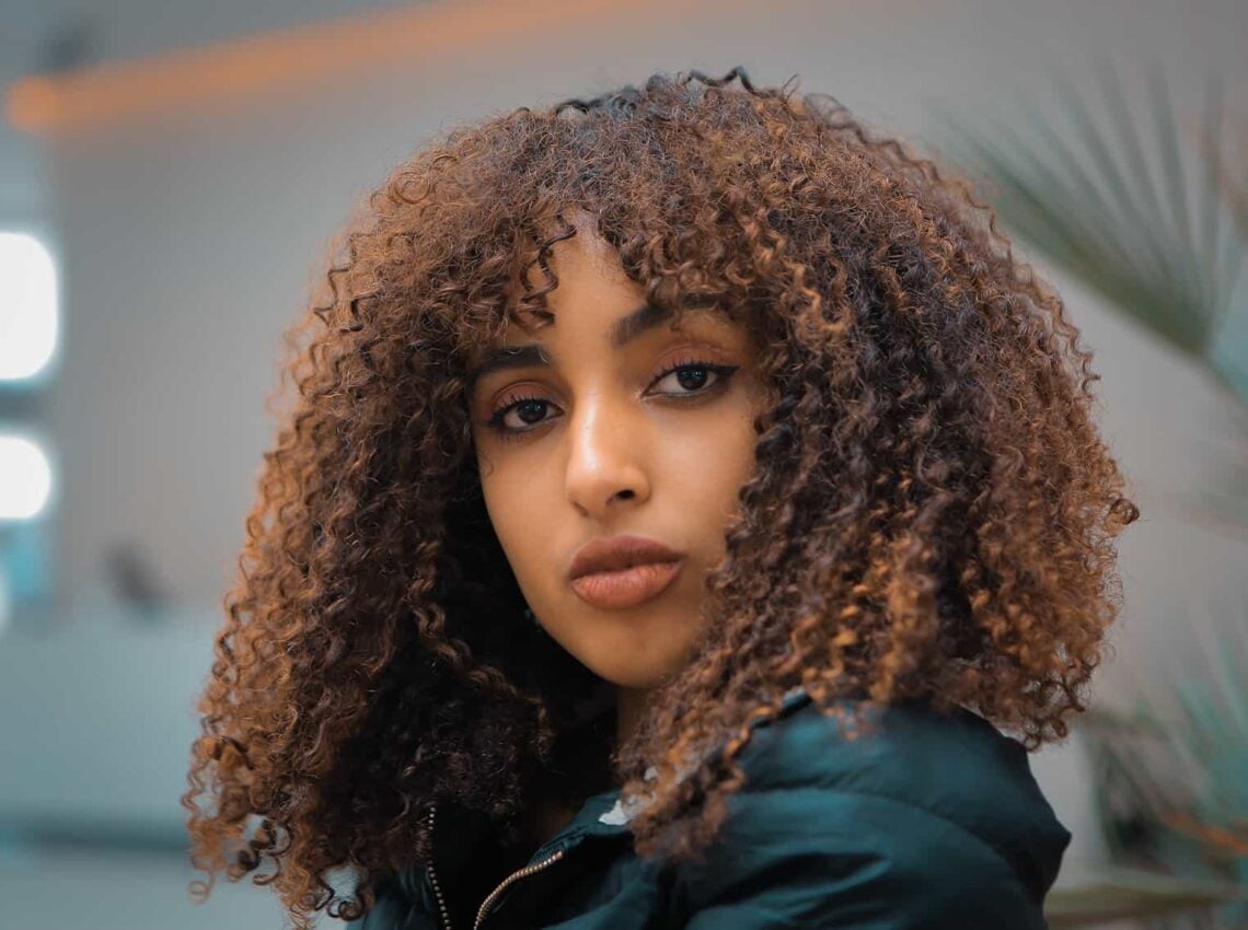 Collarbone Layers With Curtain Bangs — Classy Curly Hair Natural