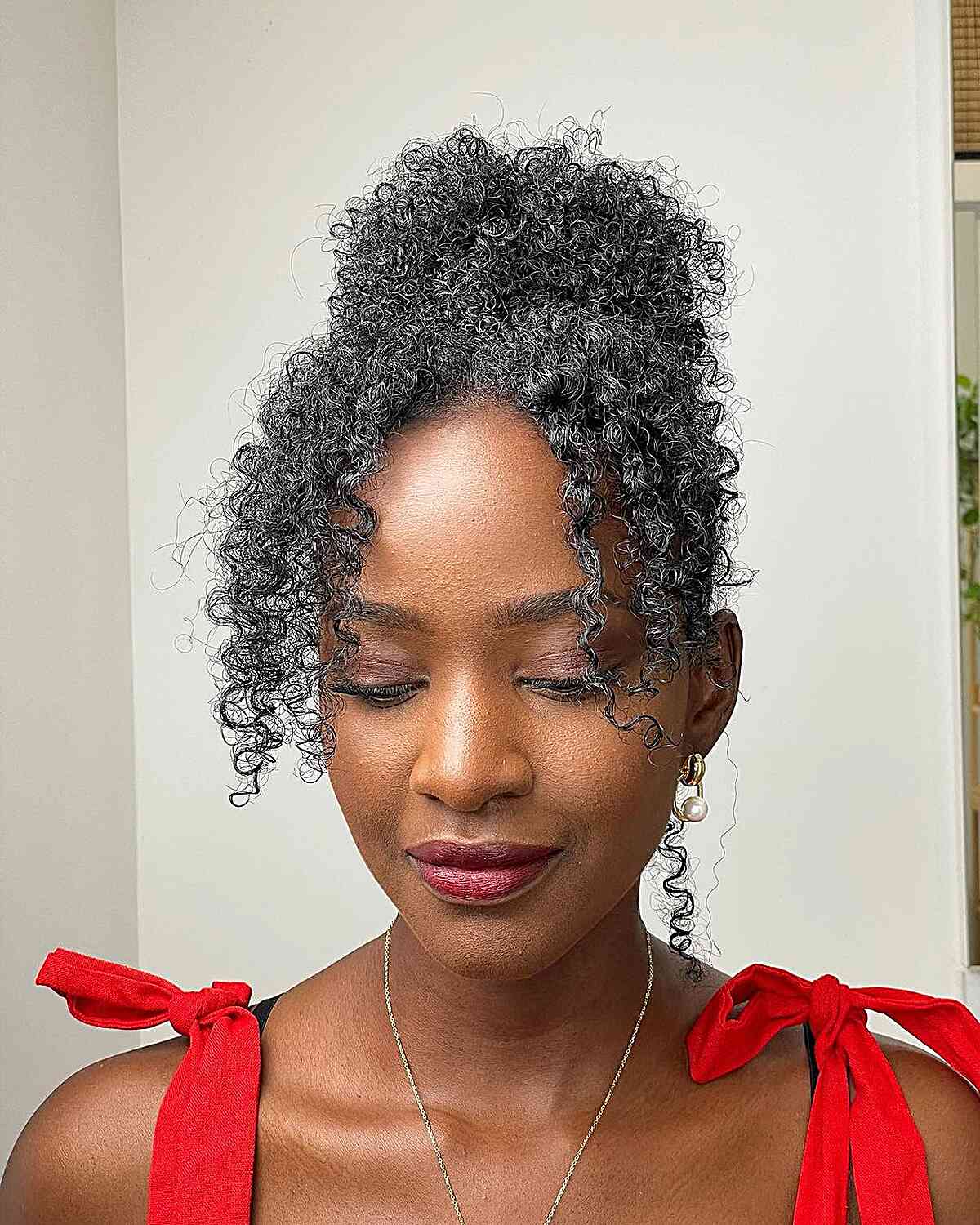 Shoulder Length Black Updo With Gray Streaks And Curly Bangs — Classy Curly Updo