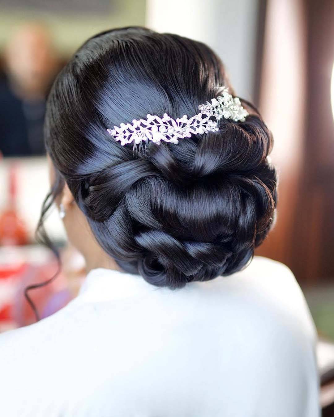 Sleek Dark Brown Voluminous Bun With Silver Accessory — Classy Curly Updo