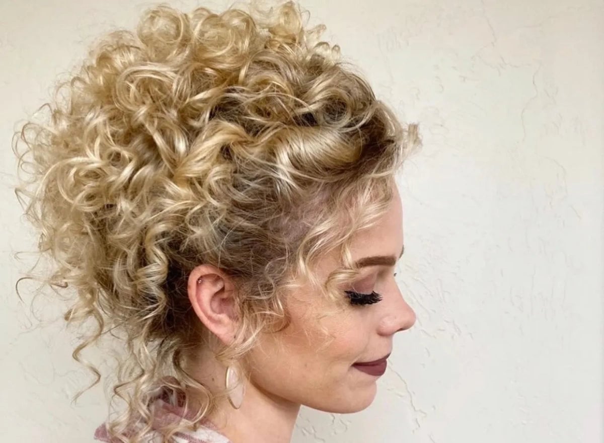 Voluminous Blonde Curly Updo With Curtain Bangs — Classy Curly Updo